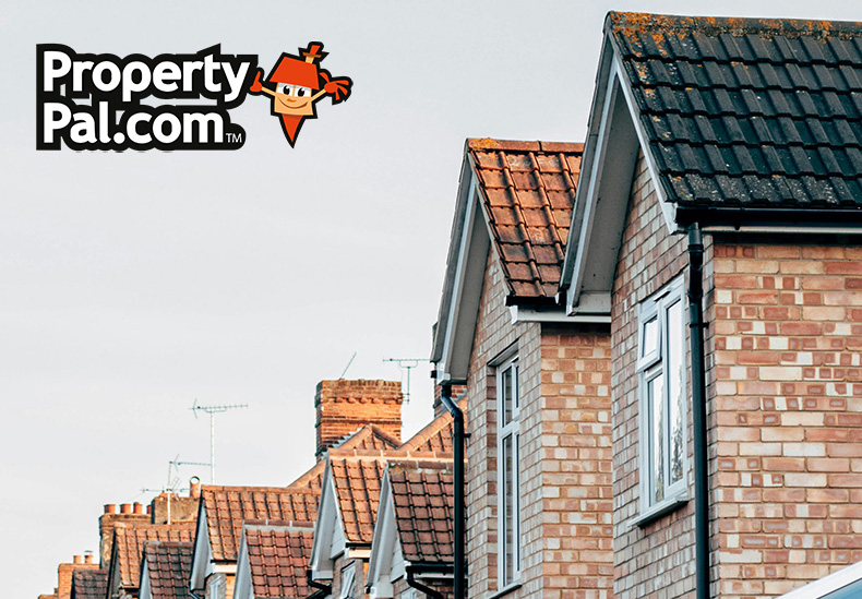 A row of UK houses with pitched roofs copy